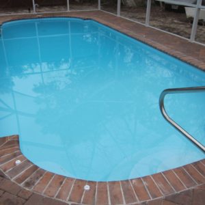 Roman 13' x 30' Pettit Fiberglass Pool with pavers