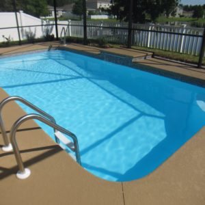 Tropical 13' x 25' Pettit Fiberglass Pool with waterfall cantilever and waterline tile